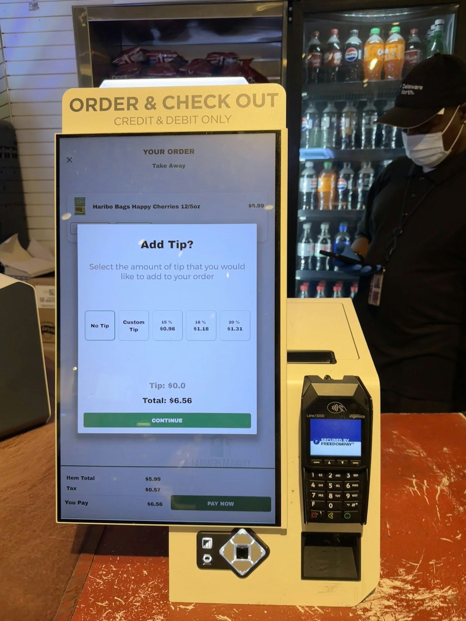 TranziPOS running on a touch terminal at a retail counter